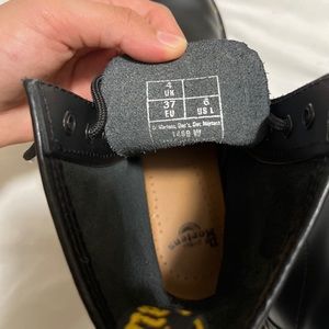Black original Dr. Martens leather boots.